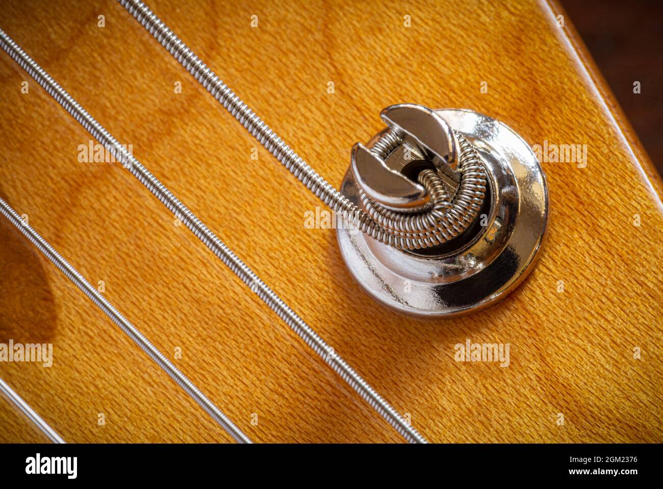 Detail of strings and a tuning keys, of an electric guitar Stock Photo