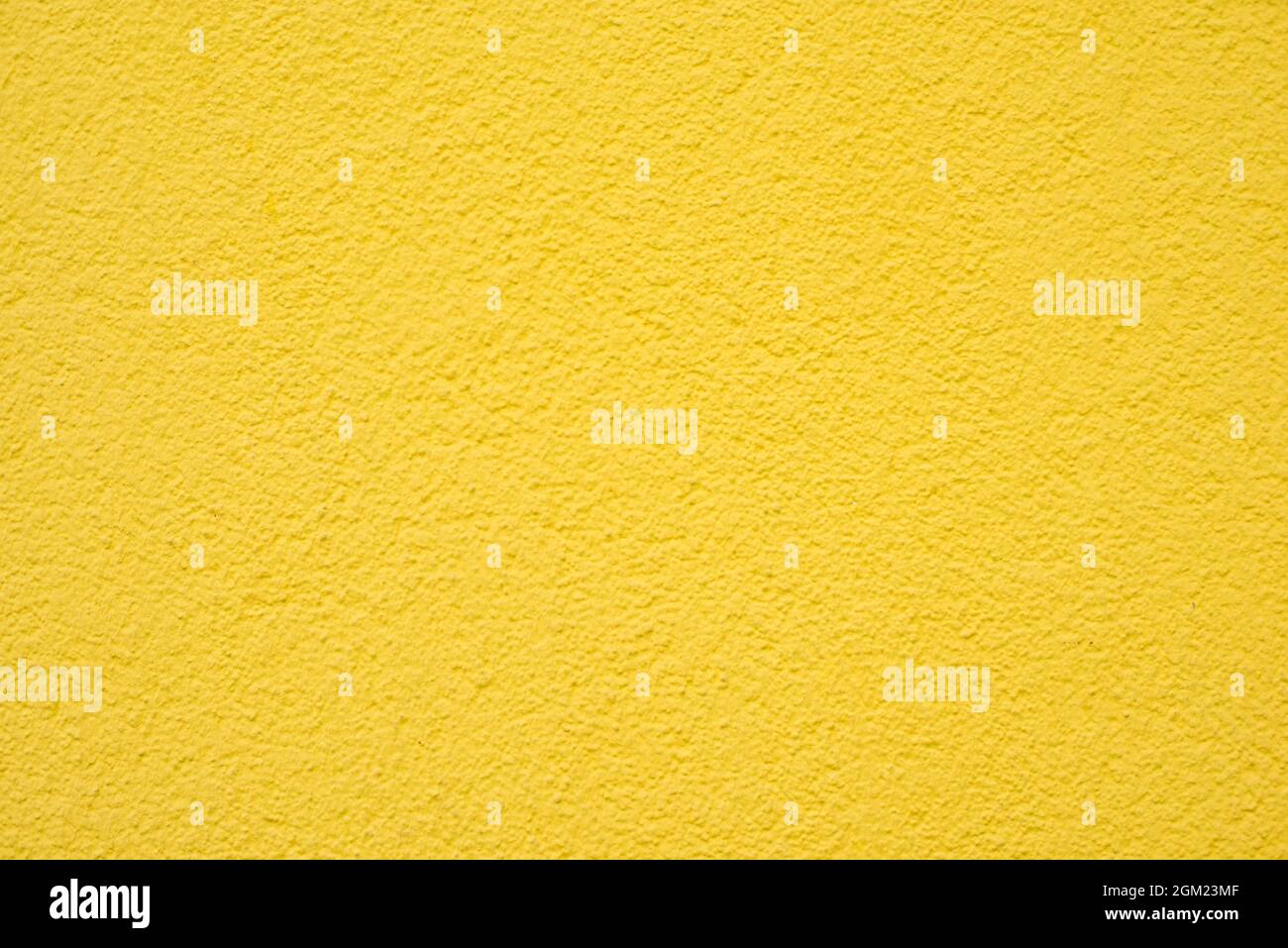 Yellow colored wall with a textur Stock Photo