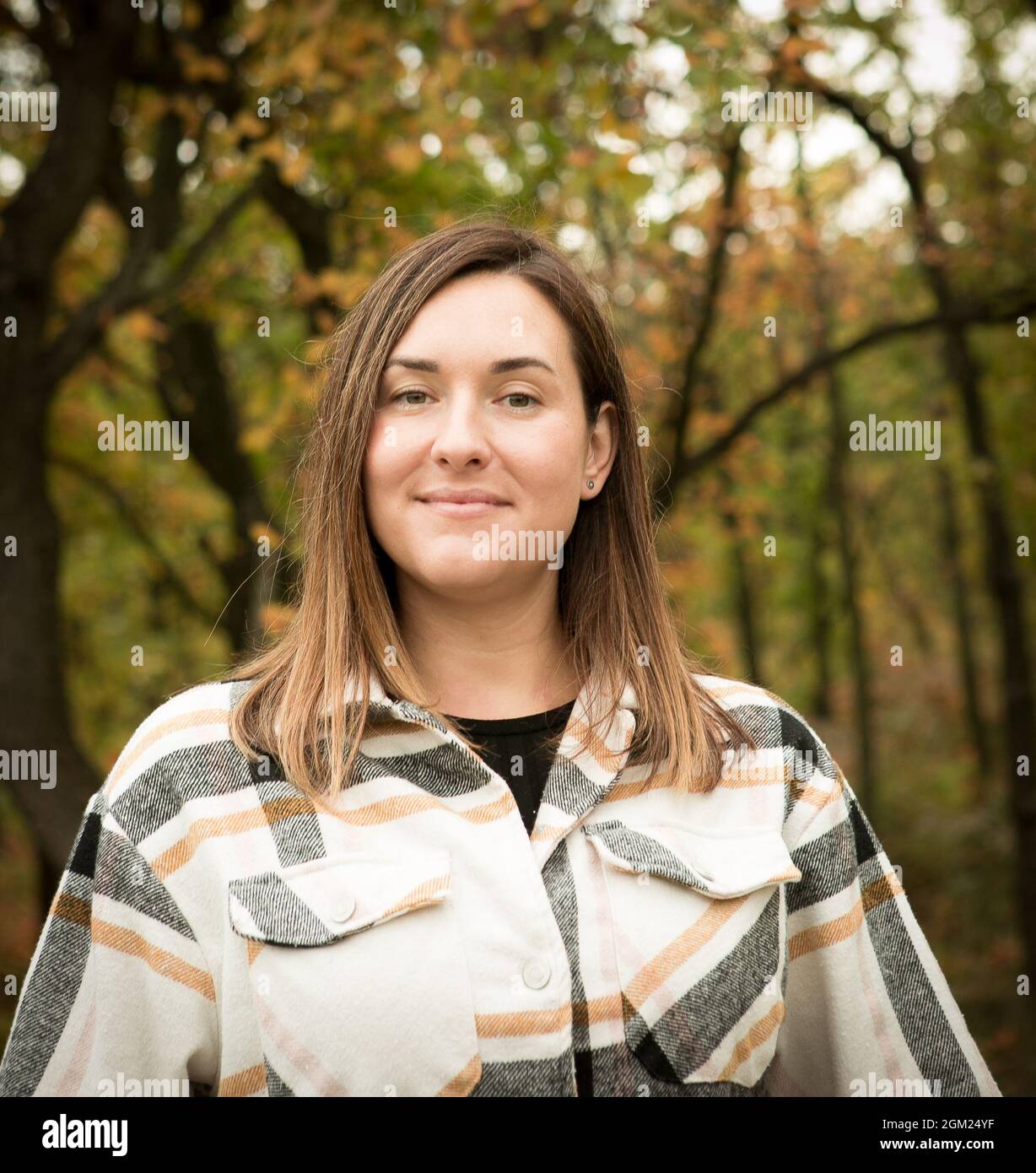 Fall. Portrait of a young beautiful woman in a yellow autumn forest ...
