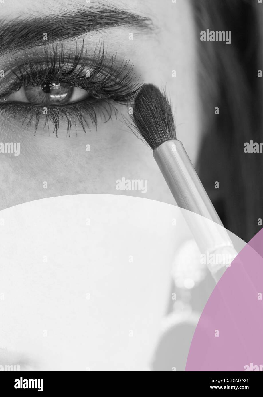 Purple and white banner with copy space against close up of woman doing eye makeup Stock Photo