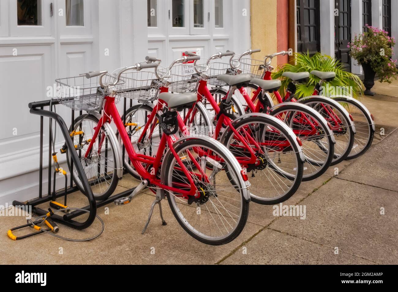 Charleston SC Bicycles Red bikes lined up outside the Vendue Inn