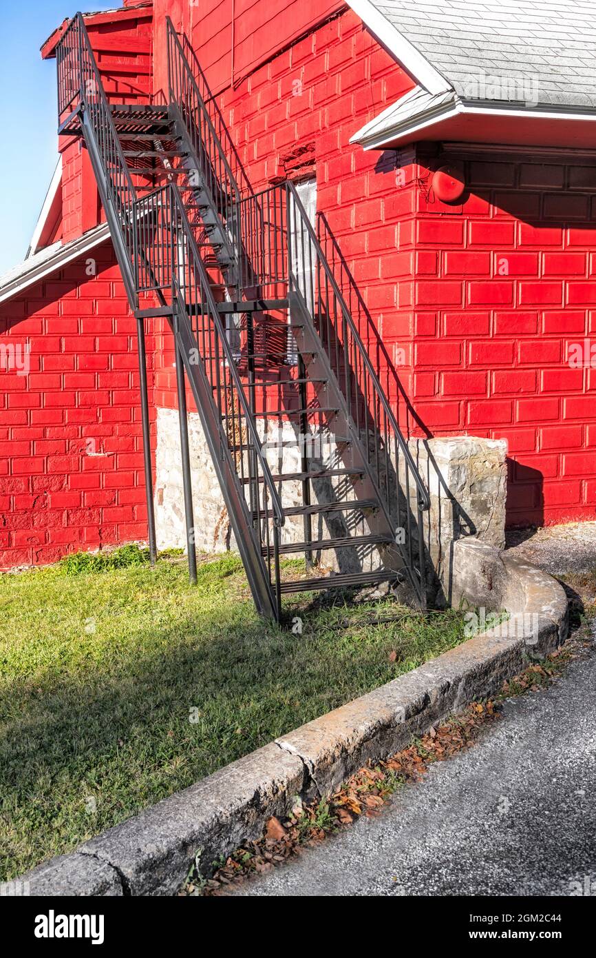 Red Barn Fire Escape  - Shadow play on the exterior stairway at a red barn in Sussex County, New Jersey.   This image is also available as a black and Stock Photo