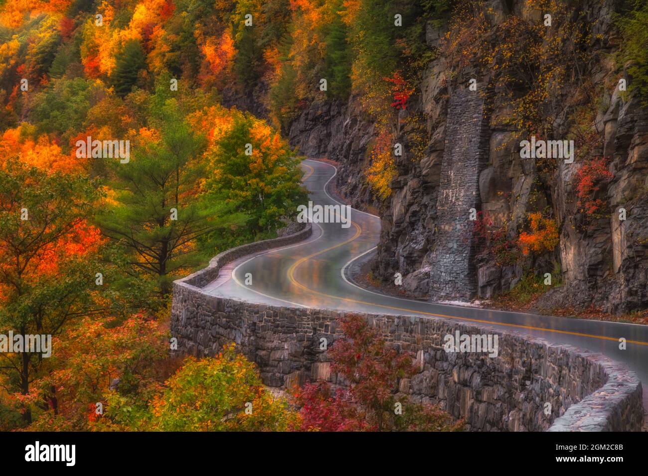 Autumn At Hawks Nest Road  - Car trails along the winding road during autumn in Port Jervis, New York.  This image is available in color as well as bl Stock Photo
