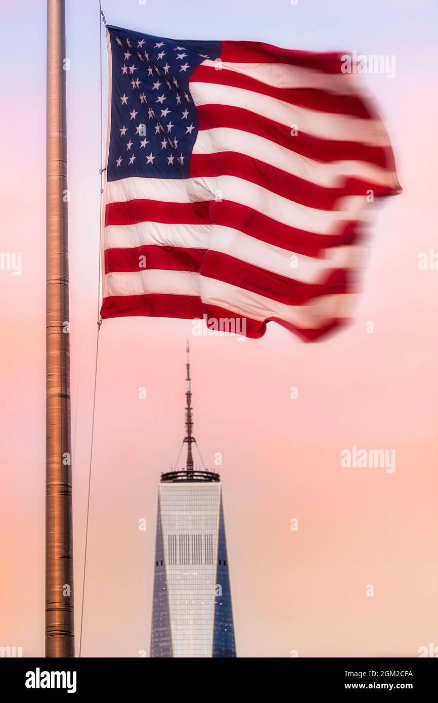 Old Glory And WTC - The American flag flying above One World Trade Center commonly referred to as the Freedom Tower in lower Manhattan in New York Cit Stock Photo
