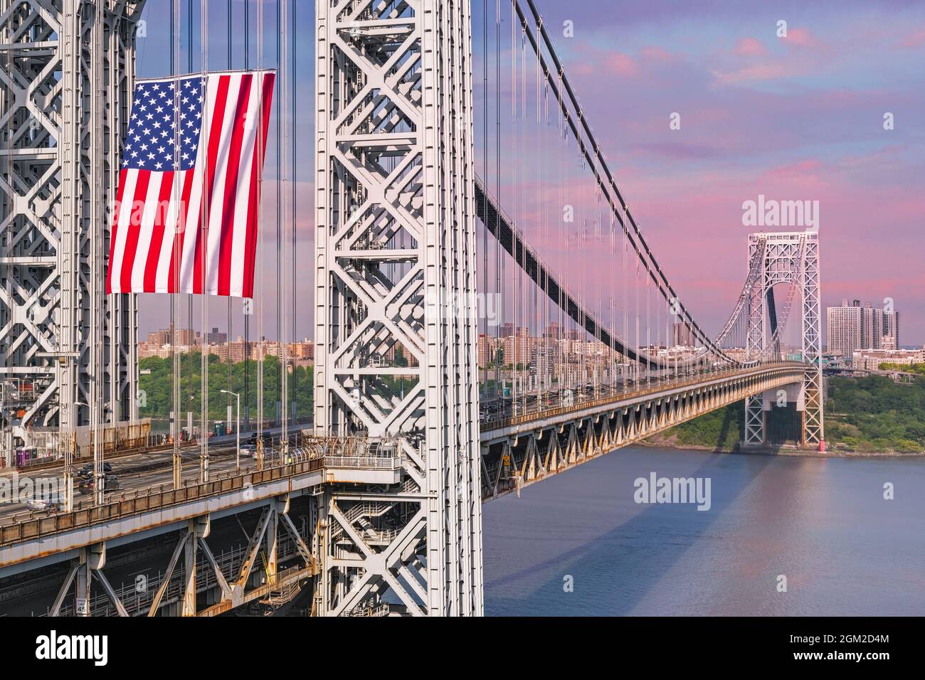 George Washington Bridge GWB USA - View of the New Jersey NJ side stanchion with the worlds largest free flying American flag.   The GW is also referr Stock Photo