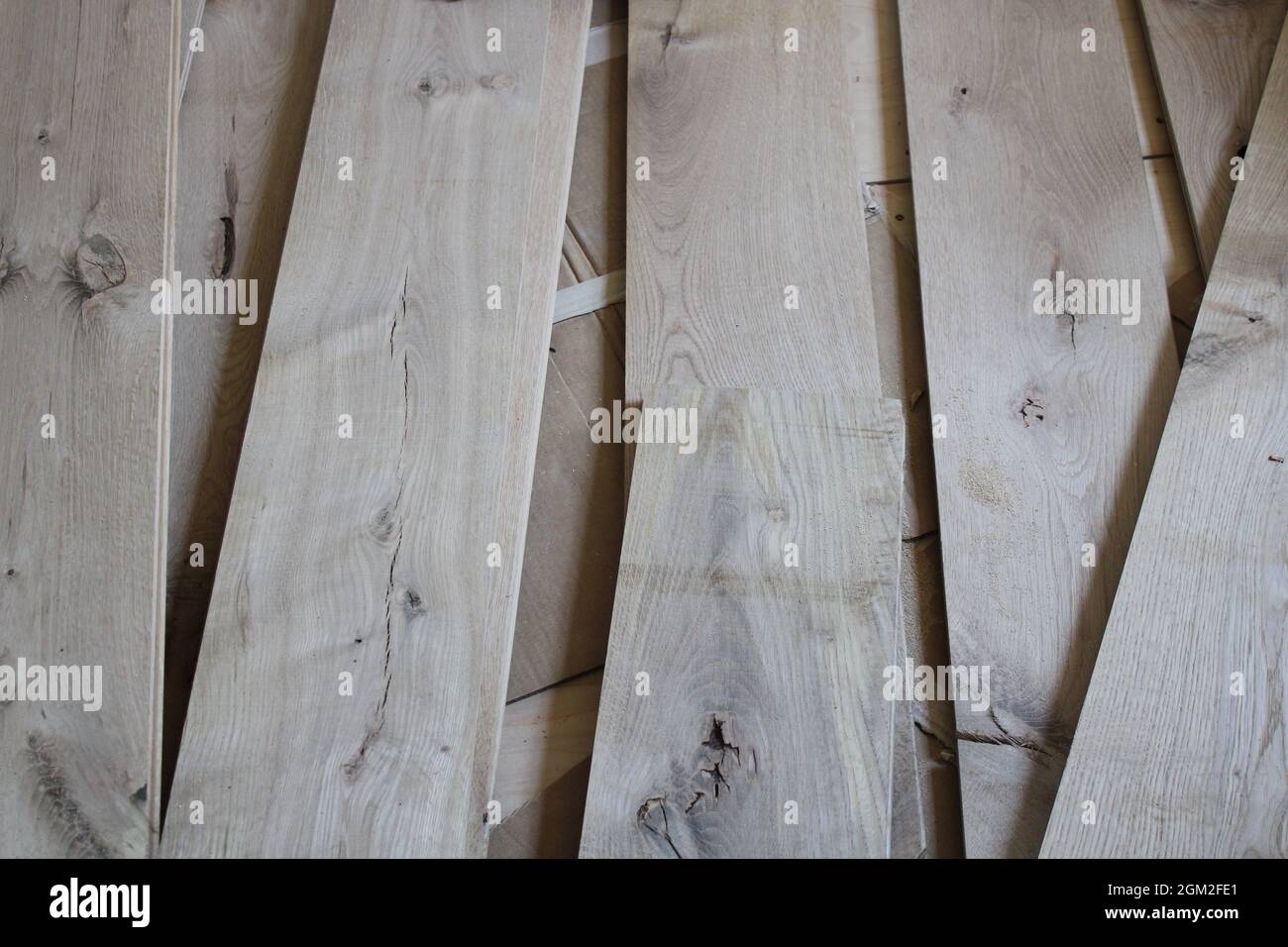 Loosely Laid Out White Oak Flooring Planks Stock Photo