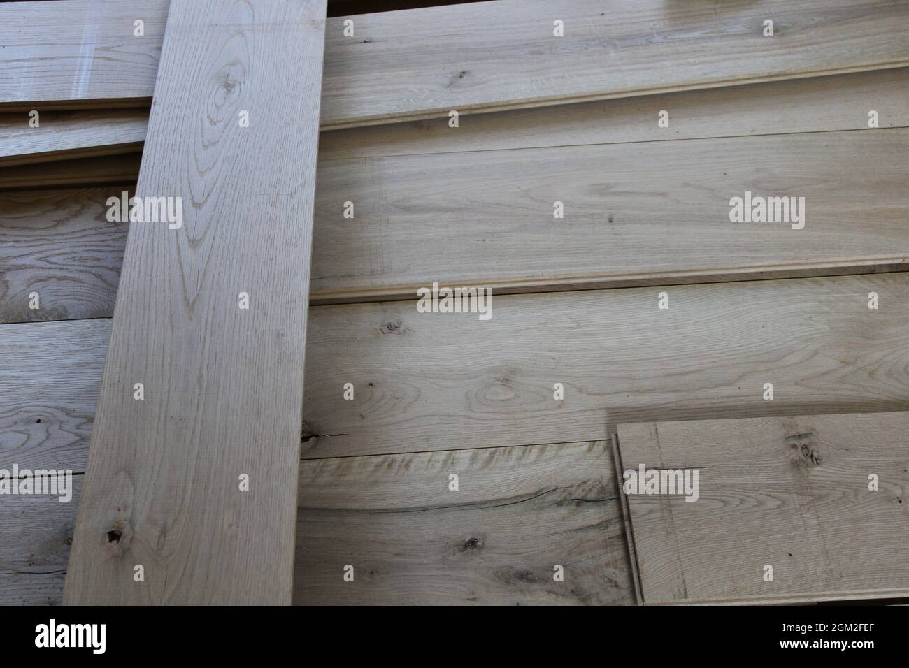 Tongue and Groove Oak Floorboards in a Pile Stock Photo
