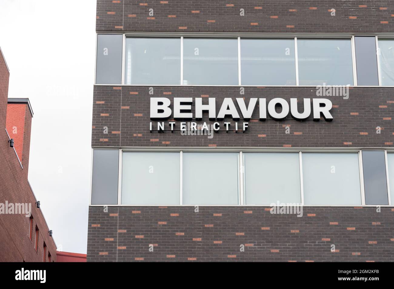 Montreal, Quebec, Canada - September 6, 2021: Behaviour Interactive sign at their headquarters in Montreal, Quebec, Canada. Stock Photo
