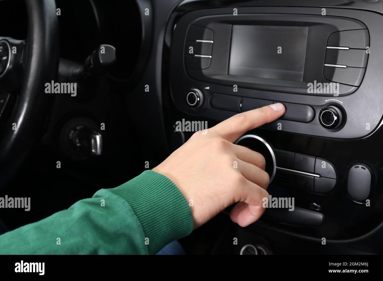 Man tuning radio in car Stock Photo Alamy
