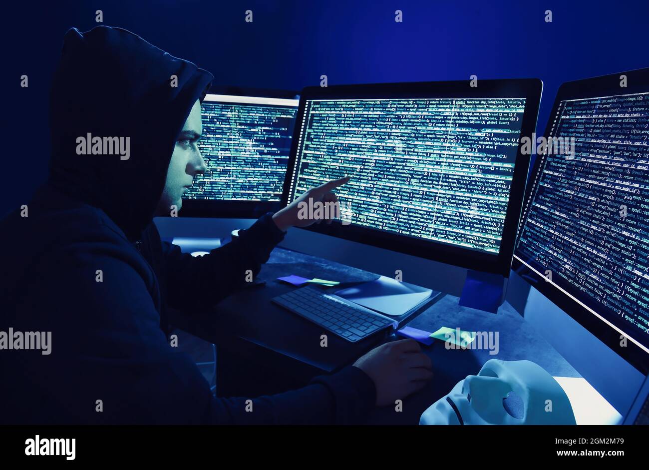 Hacker using computer in dark room Stock Photo Alamy