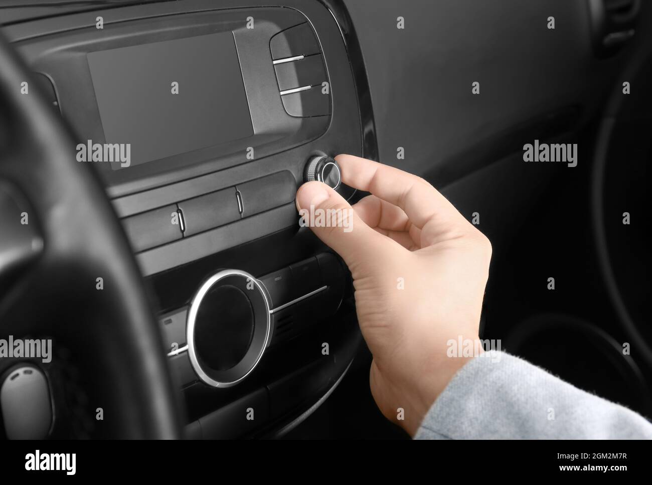Man tuning radio in car Stock Photo Alamy