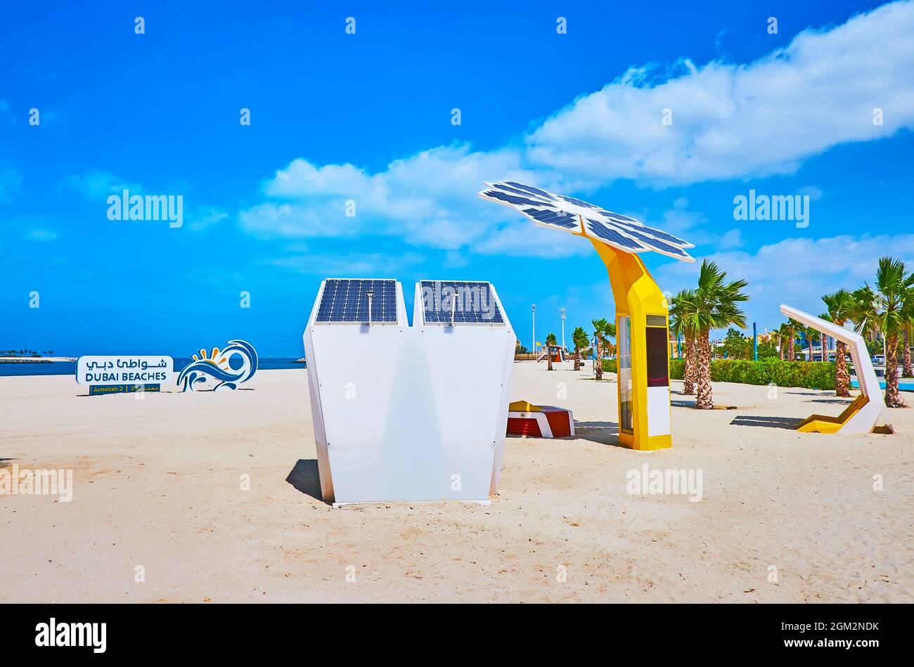 Jumeirah beach is equipped with solar powered chargers and smart palm trees, providing WIFI and charging points, Dubai, UAE Stock Photo