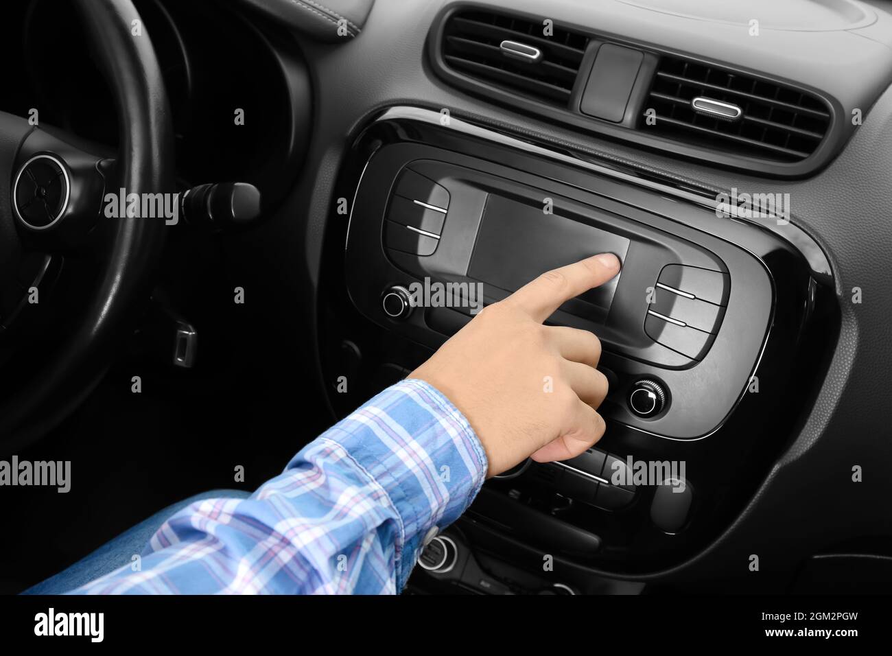 Man tuning radio in car Stock Photo Alamy