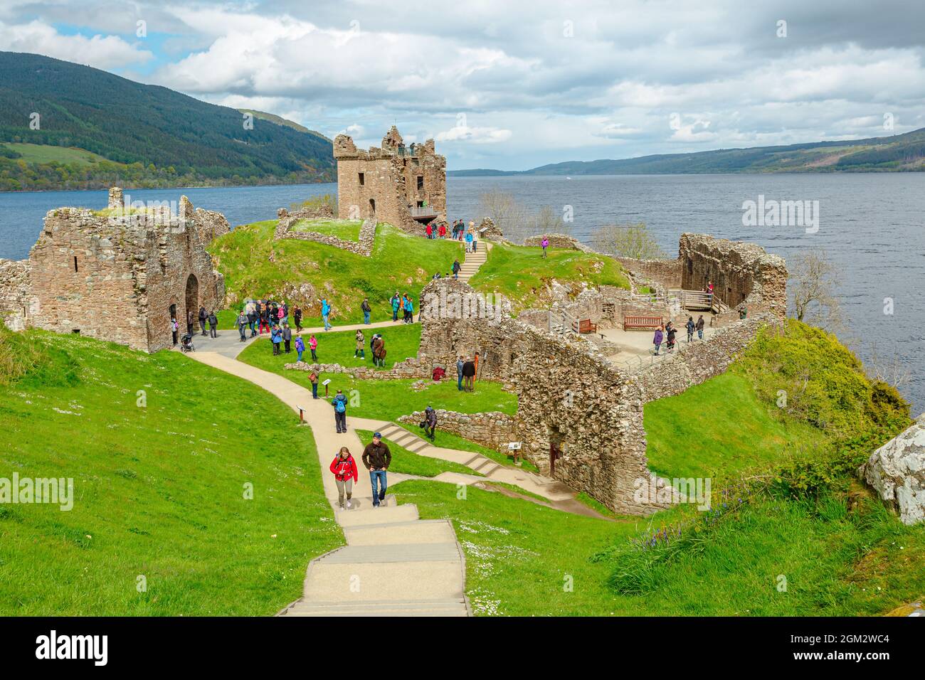 Loch Ness, Scotland, United Kingdom - May 24, 2015: top view of tourists visiting Urquhart Castle beside Loch Ness lake. Visited for the legend of the Stock Photo