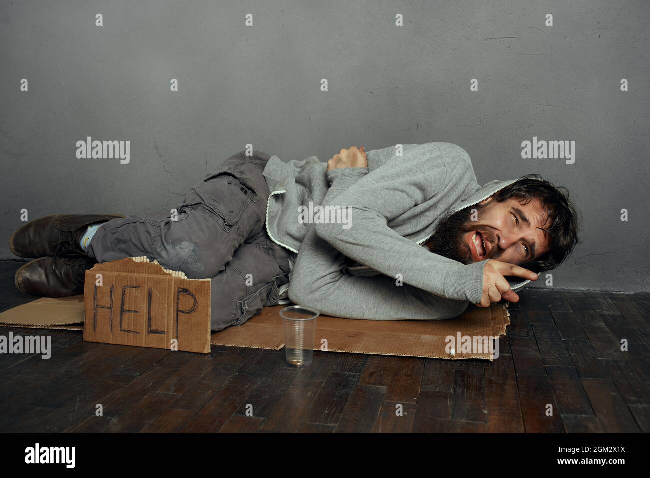 Poor man lying on floor hi-res stock photography and images - Alamy