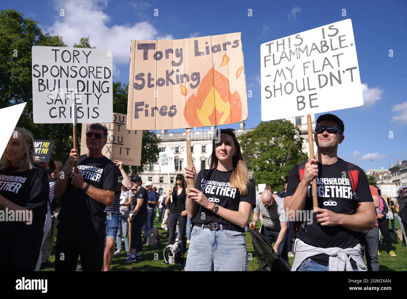 Protesters from Leaseholders Together gather at rally in Parliament Square, Westminster, central London, demanding help from the government over repair bills for their properties which are encased in potentially lethal cladding. Picture date: Thursday September 16, 2021. Stock Photo