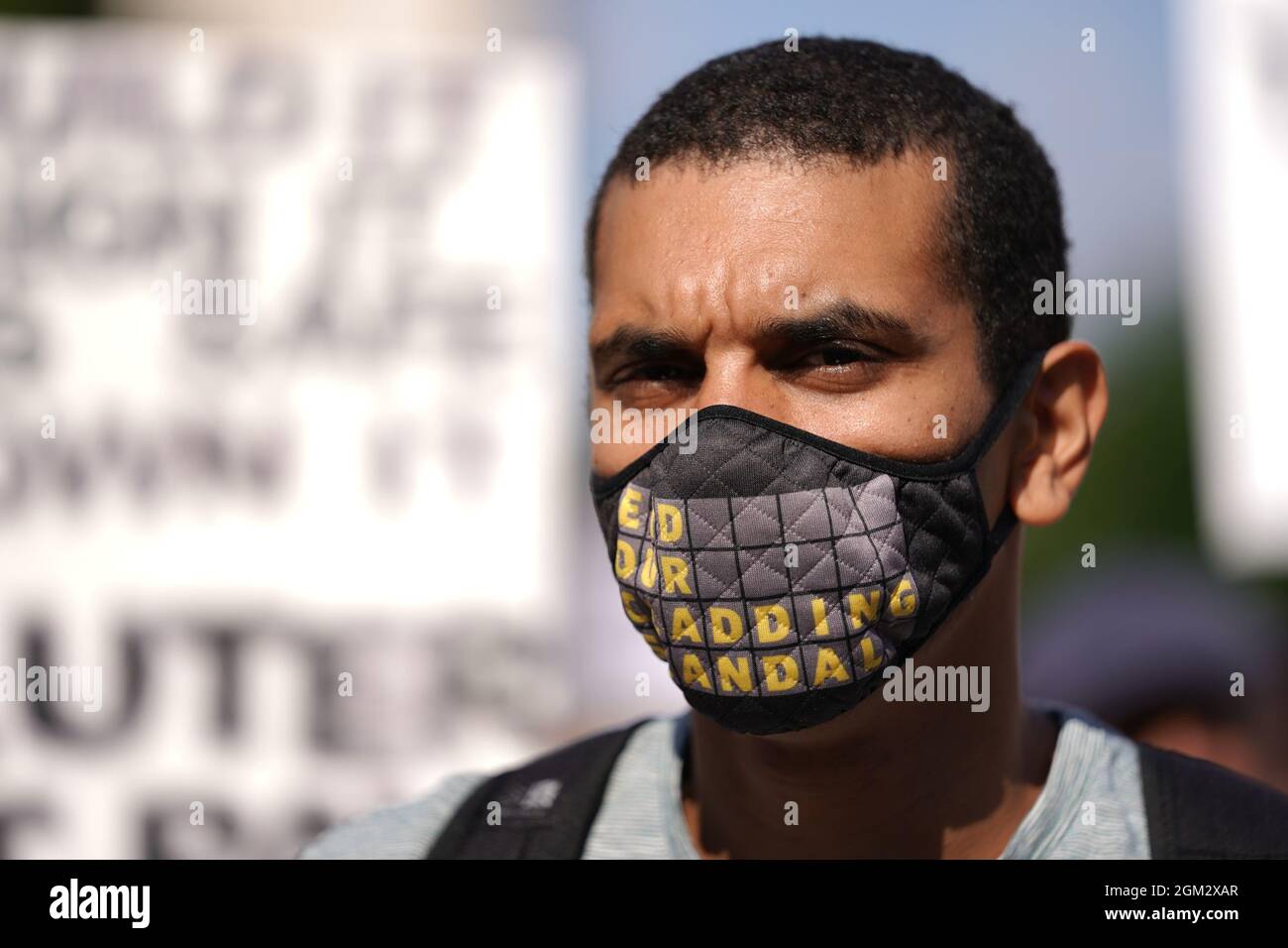 A protester at a Leaseholders Together rally in Parliament Square, Westminster, central London, demanding help from the government over repair bills for their properties which are encased in potentially lethal cladding. Picture date: Thursday September 16, 2021. Stock Photo