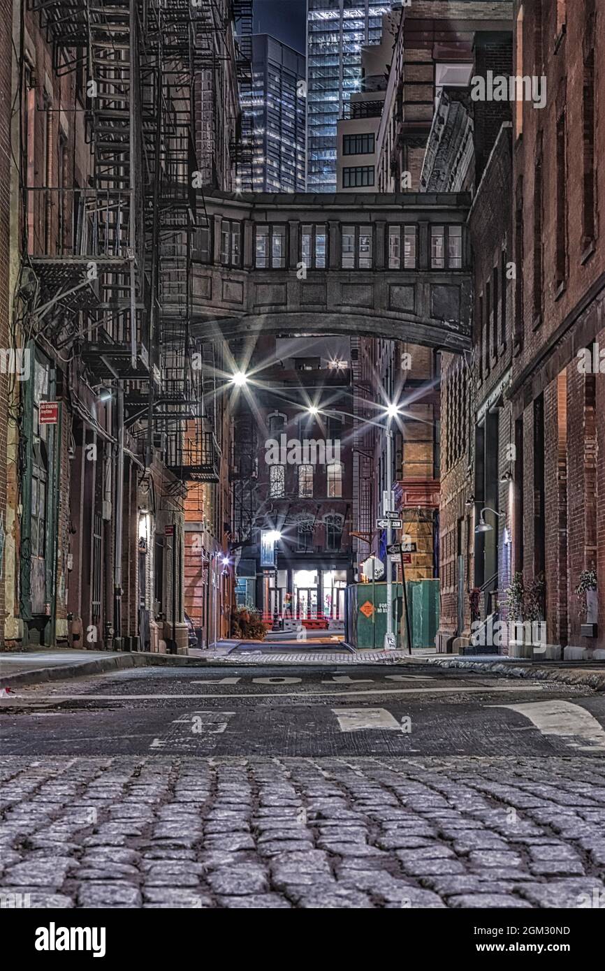 NYC Tribeca Skybridge  BW - Evening view  during the blue hour to the illuminated historic and iconic Staple Street Tribeca Skybridge located in the t Stock Photo