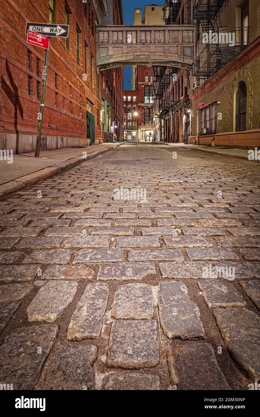 Tribeca NYC Skybridge - Evening view  during the blue hour to the illuminated historic and iconic Staple Street Tribeca Skybridge located in the the m Stock Photo