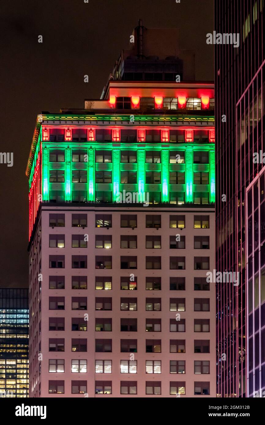 NYC Dressed Up for Xmas -  Evening close view to the illuminated midtown Manhattan, New York City building in Christmas colors.  This image is availab Stock Photo