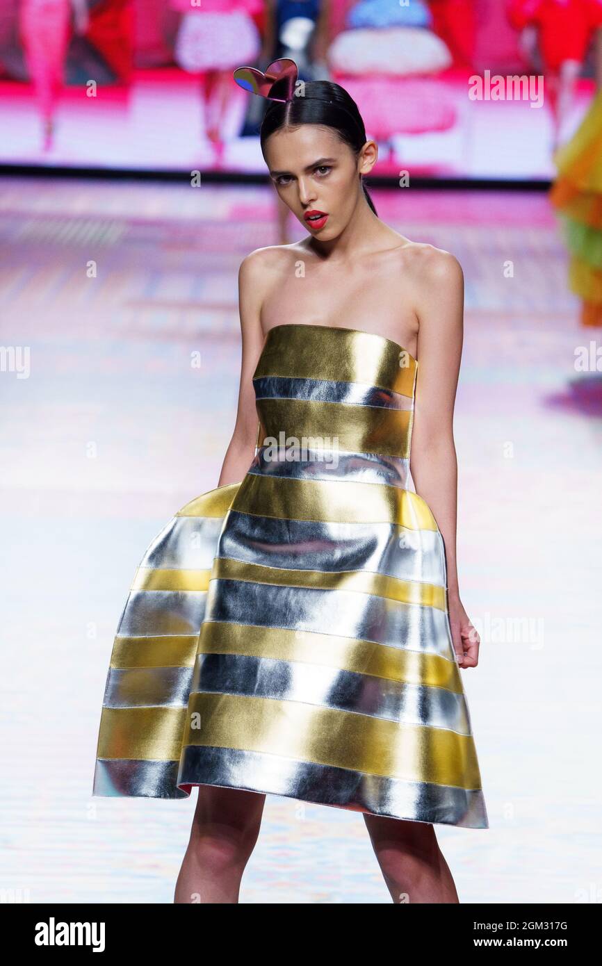 A model walks the runway at the Agatha Ruiz de la Prada fashion show ...