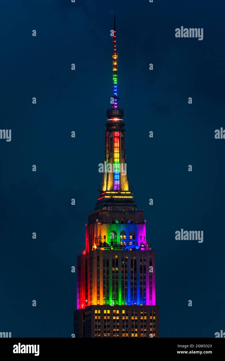 New York City ESB Pride - The Empire State Building ( ESB ) is illuminated with colors of the rainbow in celebration of the LGBT community during the Stock Photo