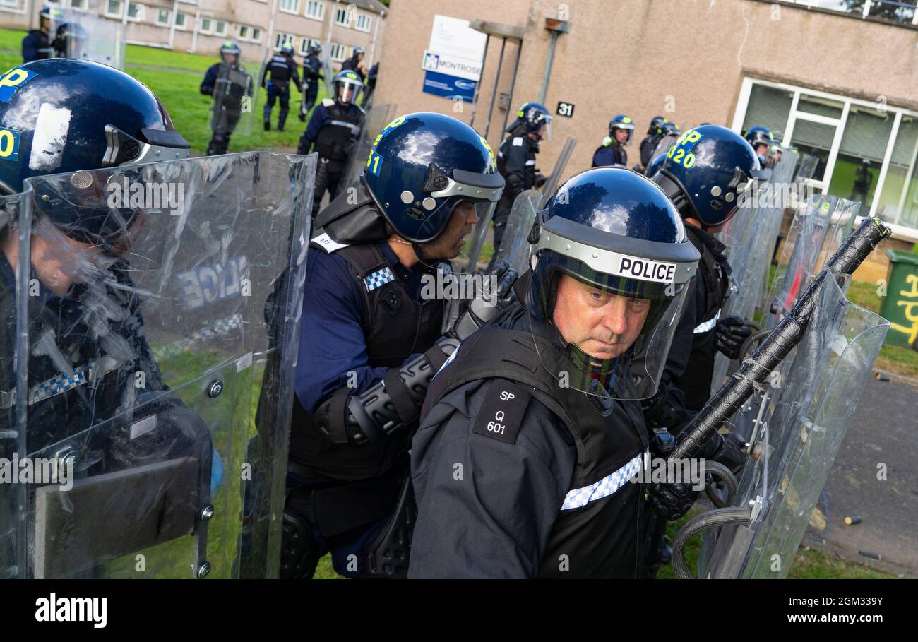 South Queensferry,, Scotland, UK. 16th September 2021. Police Scotland invite the press to witness their ongoing public order training at Craigiehall Camp at South Queensferry. The training is designed to prepare police for the upcoming COP26 event in Glasgow in November where protests are anticipated. Police in riot gear faced up  against police taking the role of protesters throwing missiles and attacking them with clubs.  Iain Masterton/Alamy Live News. Stock Photo