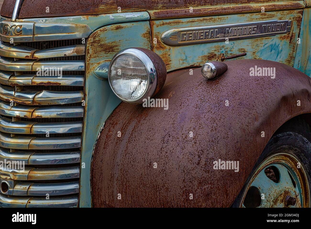 GMC General Motors Truck - Colorful rust and textures embody this vintage abandoned truck in a at a rural ghost town.  This image is available in colo Stock Photo