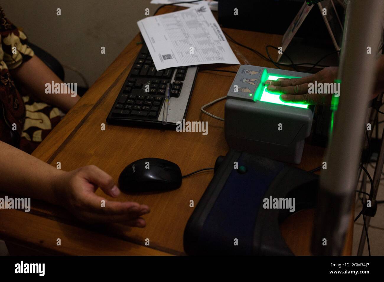 Trans Male do finger print after photo shoot for the making of e-KTP (electronic identity card) in Office of Population and Civil Registry, Jakarta, September 16,2021. The government is currently very pro-active in helping to facilitate the making of e-KTPs for transgender people. This is based on Law no. 24 of 2013 in conjunction with Law no. 23 of 2006 concerning Adminduk that all Indonesian citizens must be registered and must have a KTP and a family card in order to get good public services, for example BPJS services and social assistance.The government has an obligation to provide service Stock Photo