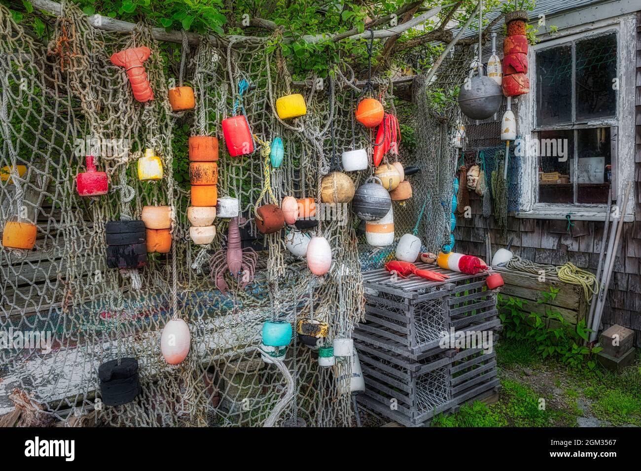 Fishing Net And Buoys Rockport  - Fishing net and buoys adorn the outside of a fishing hut at Bradley Wharf in Rockport, Massachusetts.  This image is Stock Photo