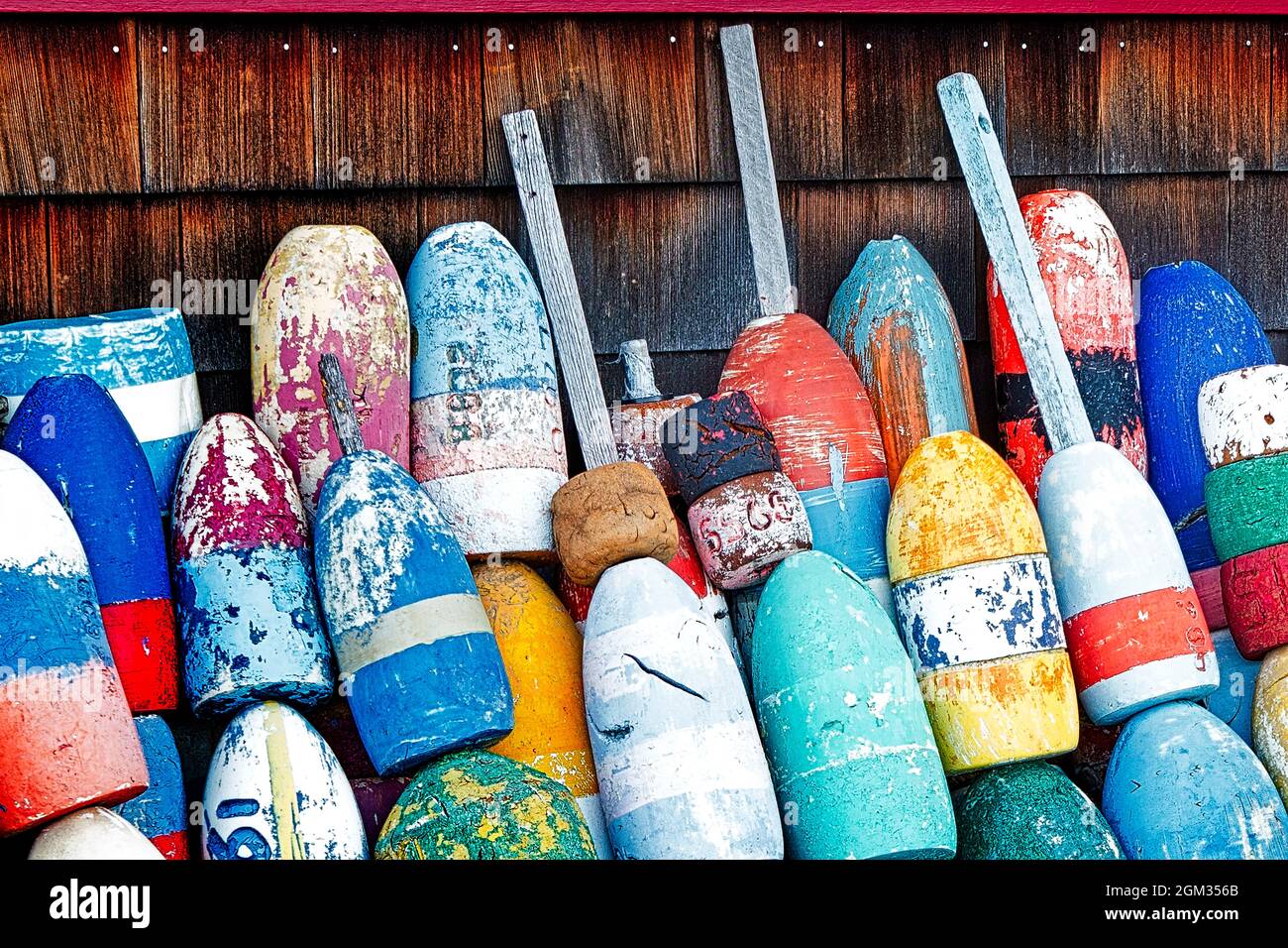 Fishing Buoys BW - Weathered but colorful fishing buoys found at Bradley Wharf at the seaport village in Rockport, Massachusetts.  This image is avail Stock Photo