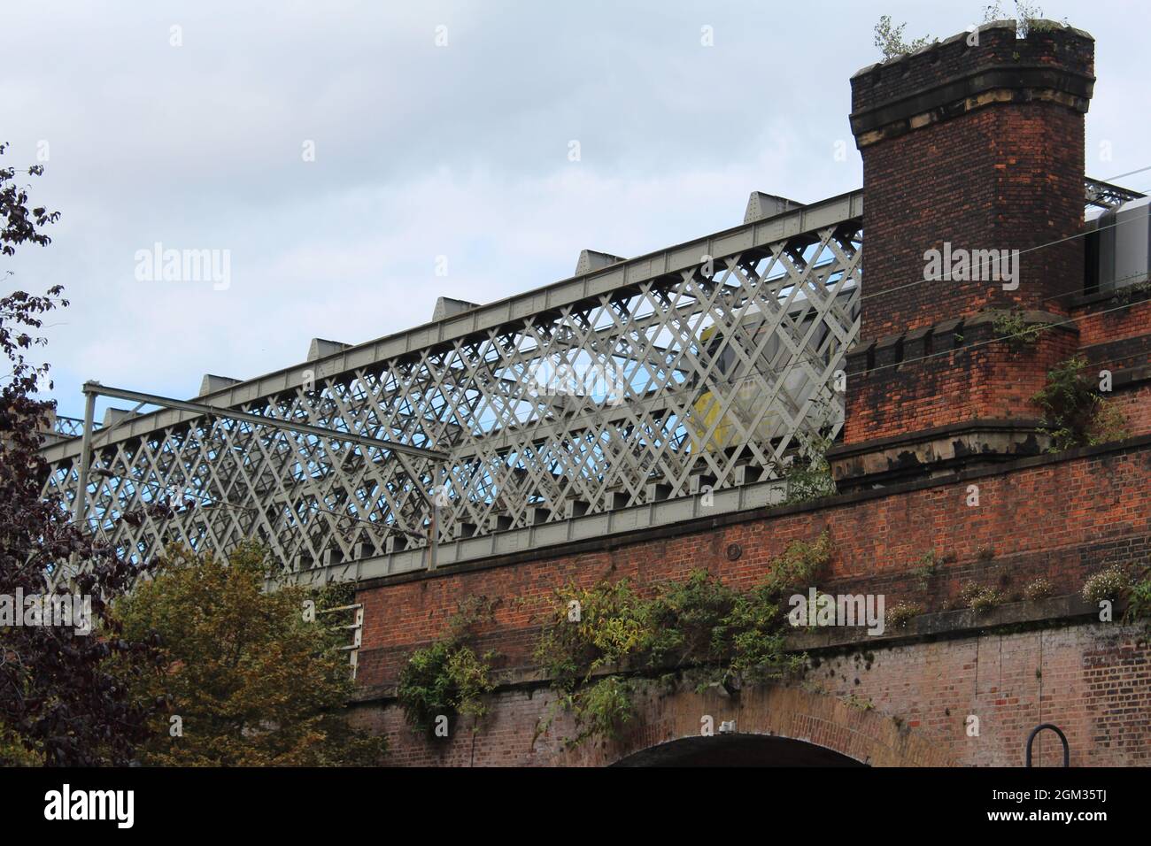 Metrolink tram on a bridge in Castlefield, Manchester Stock Photo