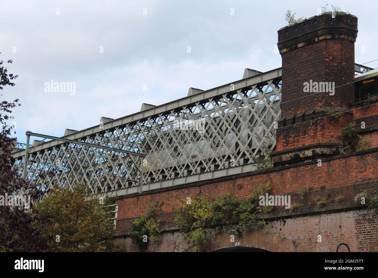 Metrolink crossing a bridge in Castlefield, Manchester Stock Photo