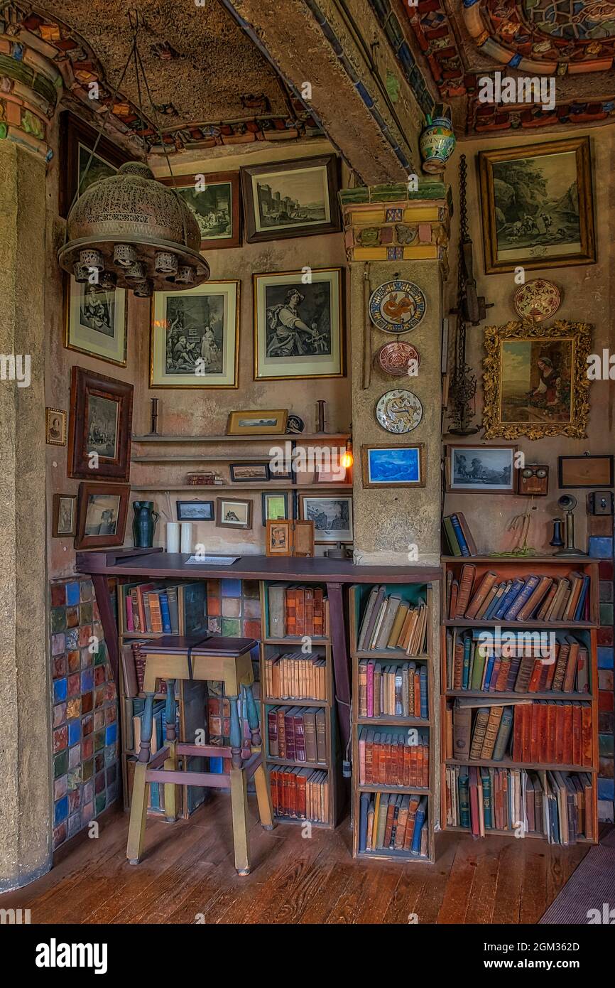 Fonthill Castle Study II - A view to an old stool, eclectic decor, many books and a desk located in the  Fonthill caslte study room which is adjacent Stock Photo