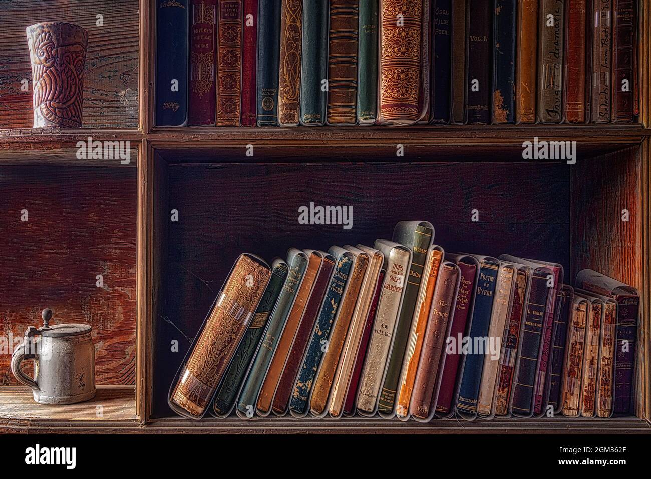 Castle Study - A view to old bookshelves with books and eclectic decor Stock Photo