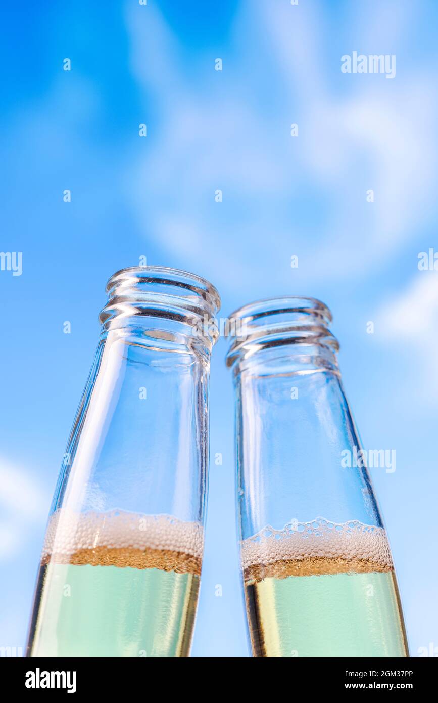 Cold Beers Toast on Beach. Blue Sky in Summer. Copy Space. Stock Photo