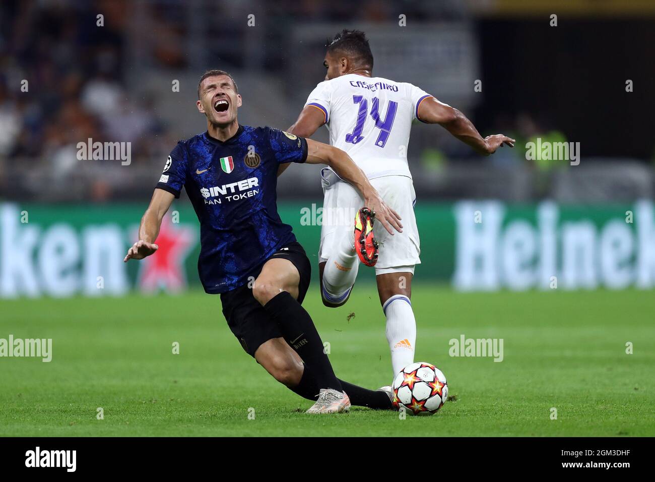 Carlos Henrique Casimiro of Real Madrid Cf and Edin Dzeko of Fc  Internazionale battle for the ball during the Uefa Champions League Group D  match between FC Internazionale and Real Madrid Fc