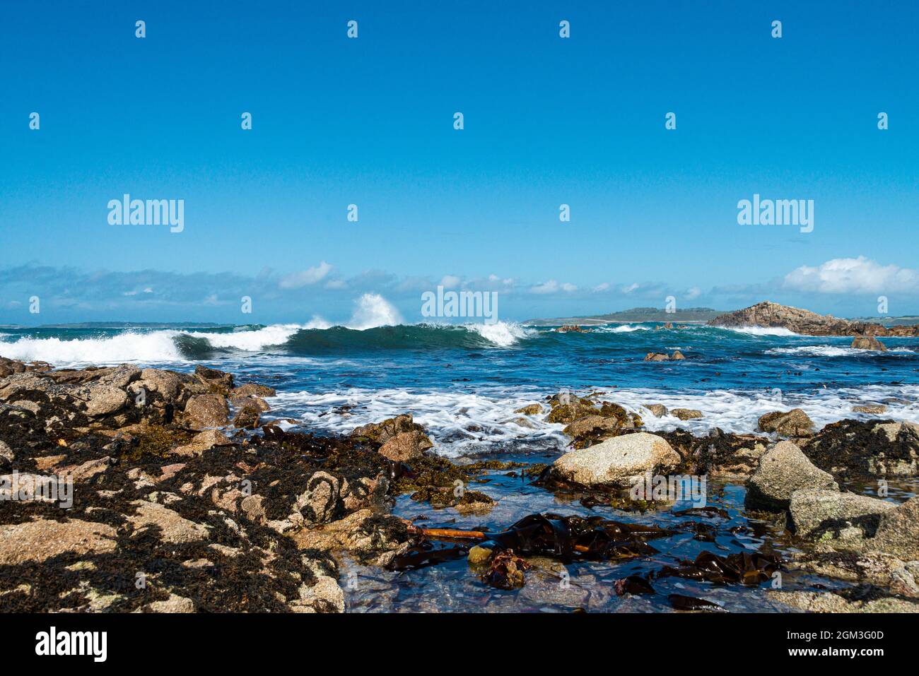 Waves crashing on rocks on the coast of St Agnes, Isles of Scilly Stock Photo