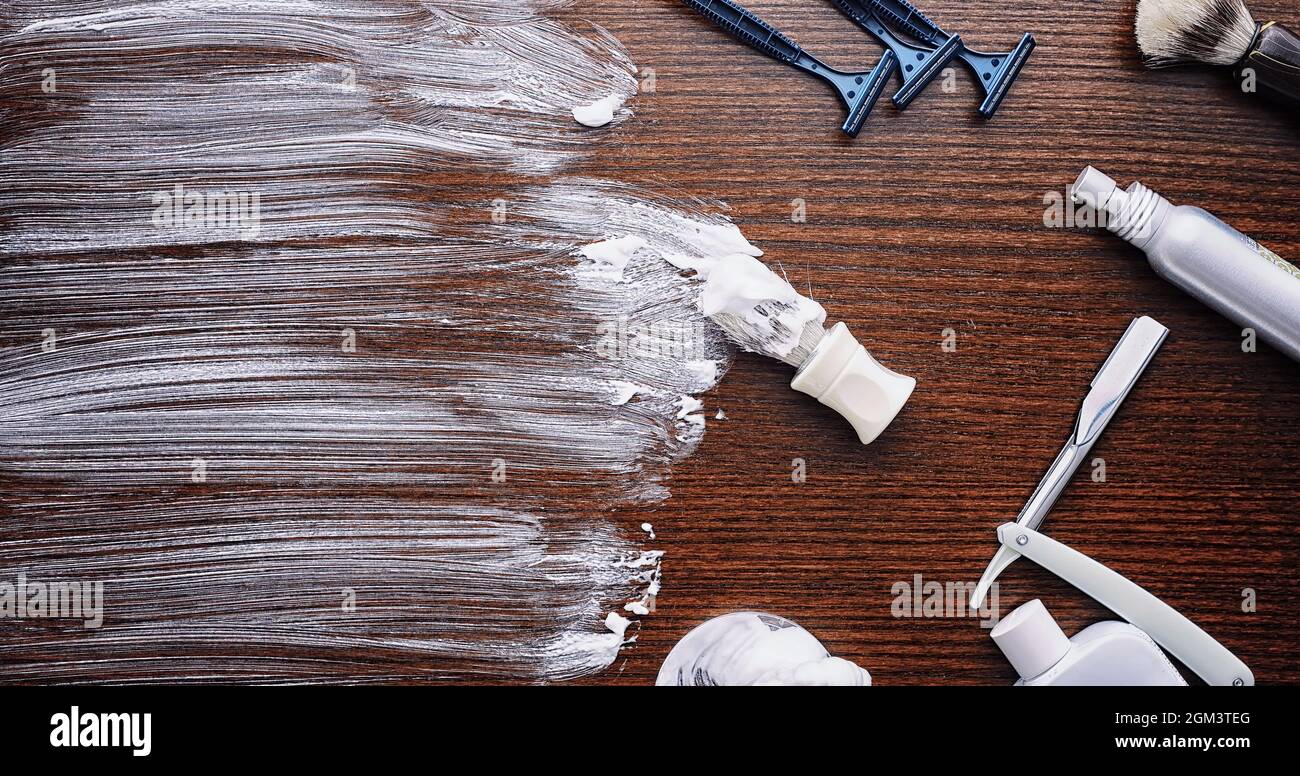 Shaving accessories on a wooden texture background. Tools. Disposable ...