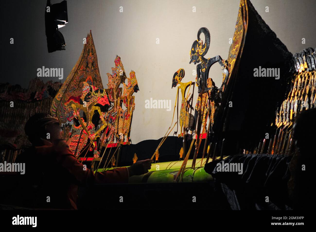 Javanese shadow puppet show or wayang kulit. Shadow puppets are usually staged from night to early morning and are free to watch by the public. Stock Photo
