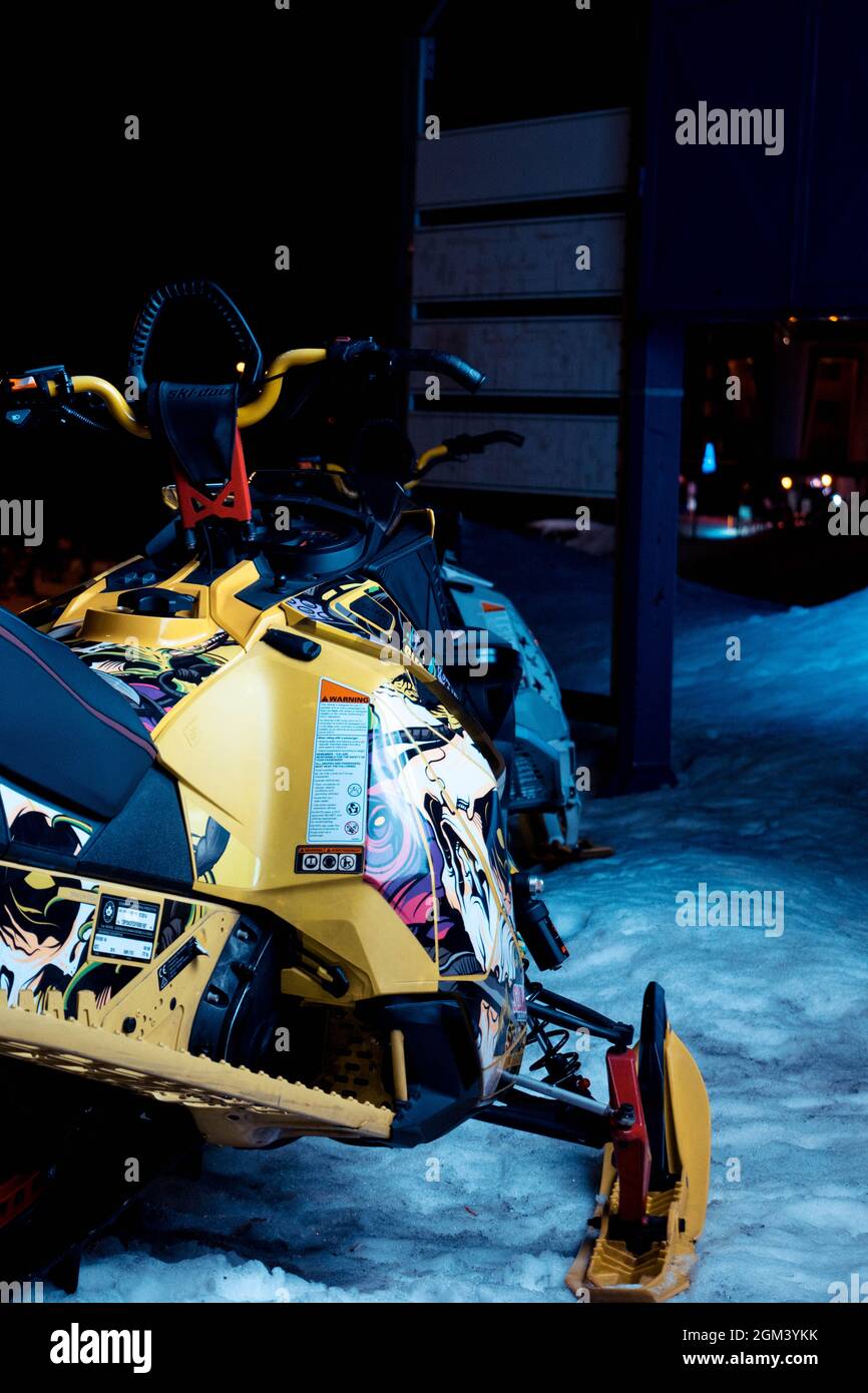 A ski snow jet parked under a blue light Stock Photo Alamy