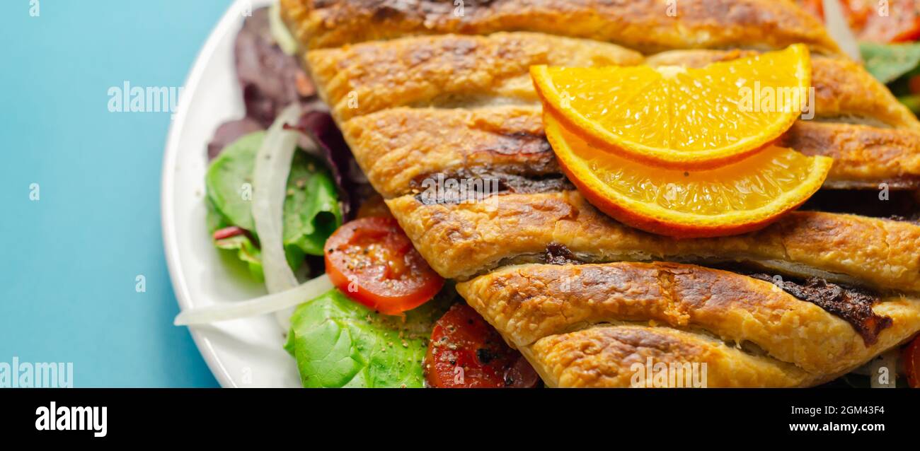Tasty steak slice, british steak with sauce, potato and leek, wrapped