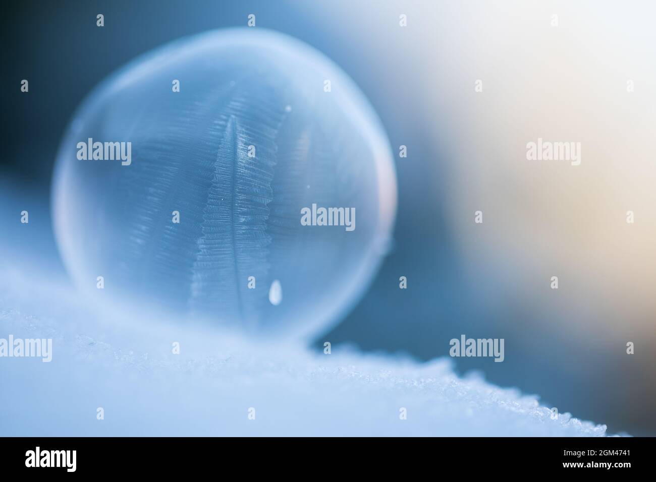 Frozen soap bubble. At a temperature below approximately -10 degrees celcius soap bubbles will freeze to ice before they burst. Stock Photo