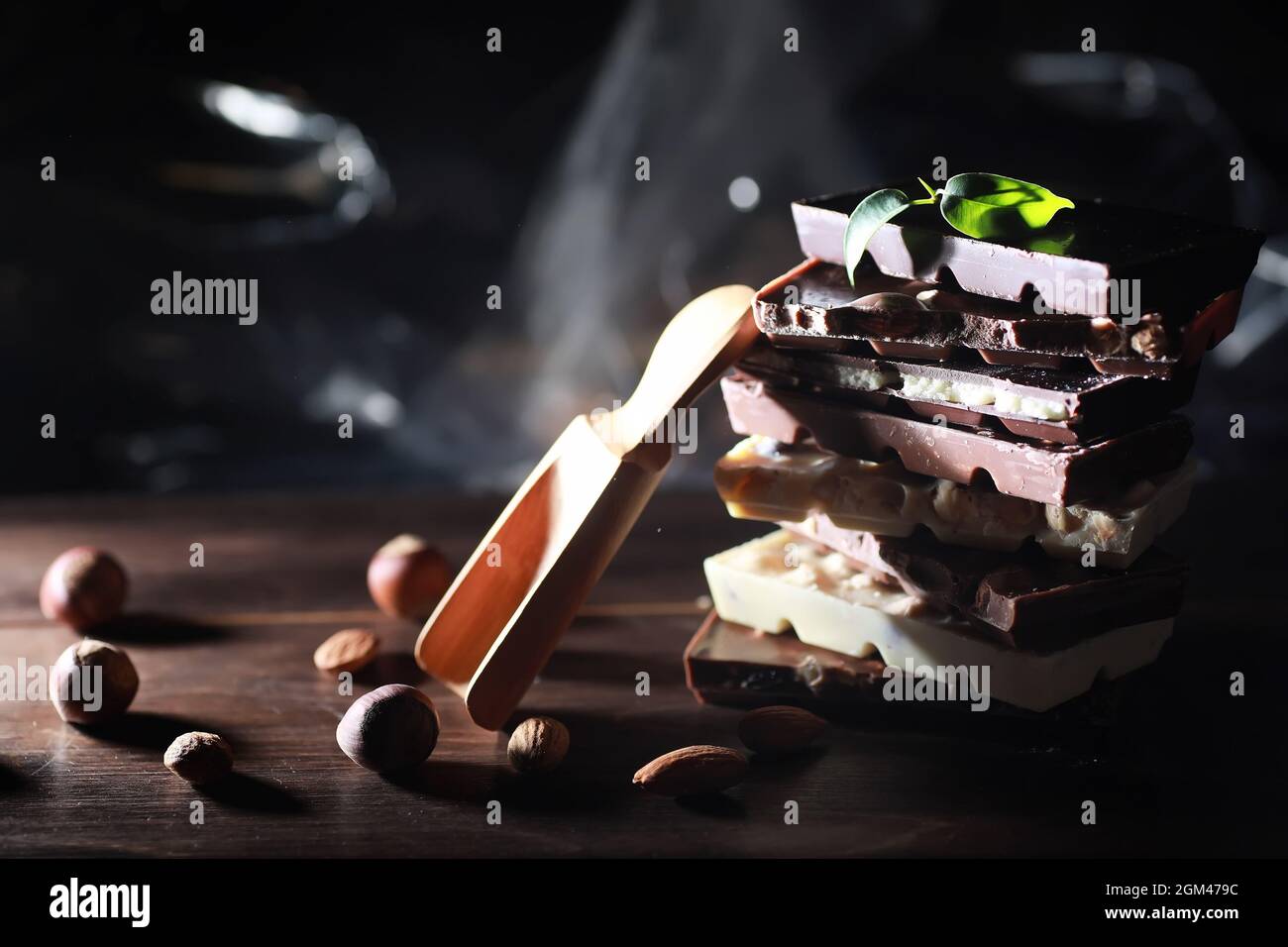 A bar of milk chocolate. Homemade milk chocolate with almonds and dried