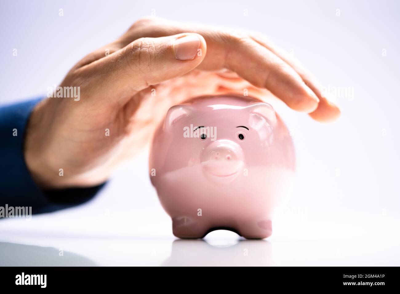 Pension And Income Protection. Save Money In Piggybank Insurance Stock Photo
