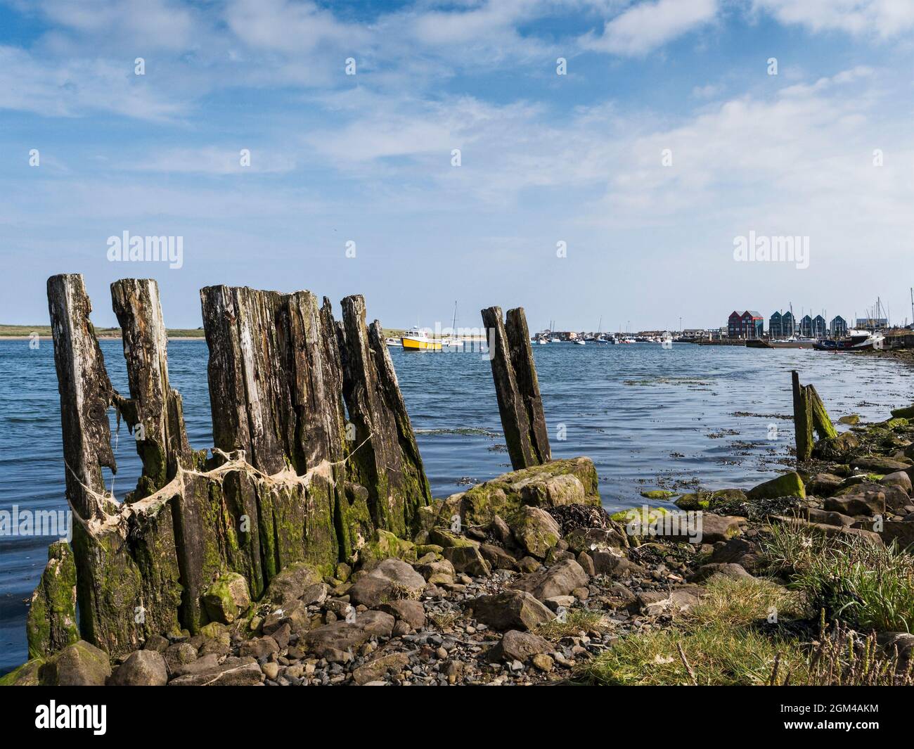 A few pieces of rotting wood is all that is left of an old boat house ...