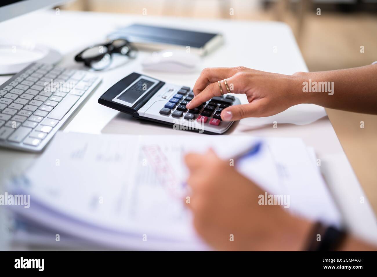 Calculating Company Business Expense Invoice And Budgeting Stock Photo