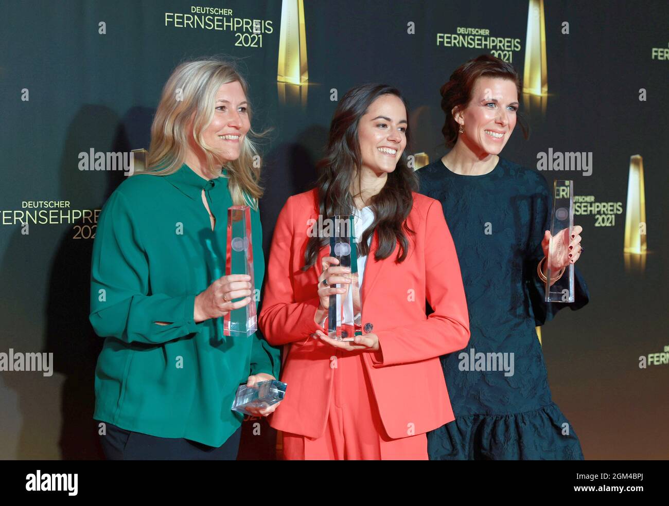 Cologne, Germany. 16th Sep, 2021. Kirsten Petersen (l-r), Irina Schlauch,  and Nina Klink, winners of the "Best Entertainment Reality" award, for  "Princess Charming" after the German Television Award 2021 ceremony at the