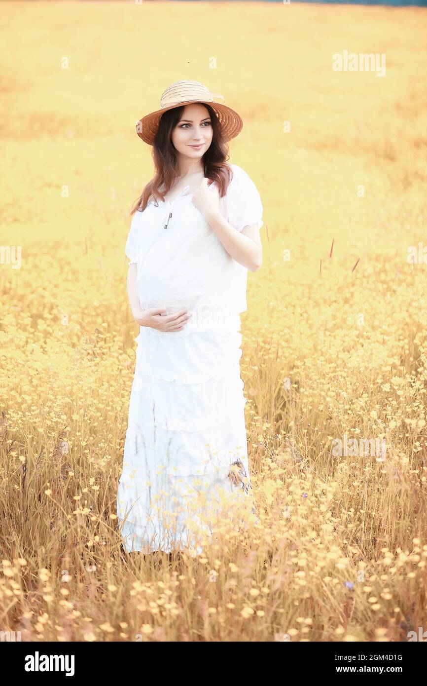 Pregnant woman in nature for a walk in the autumn Stock Photo - Alamy