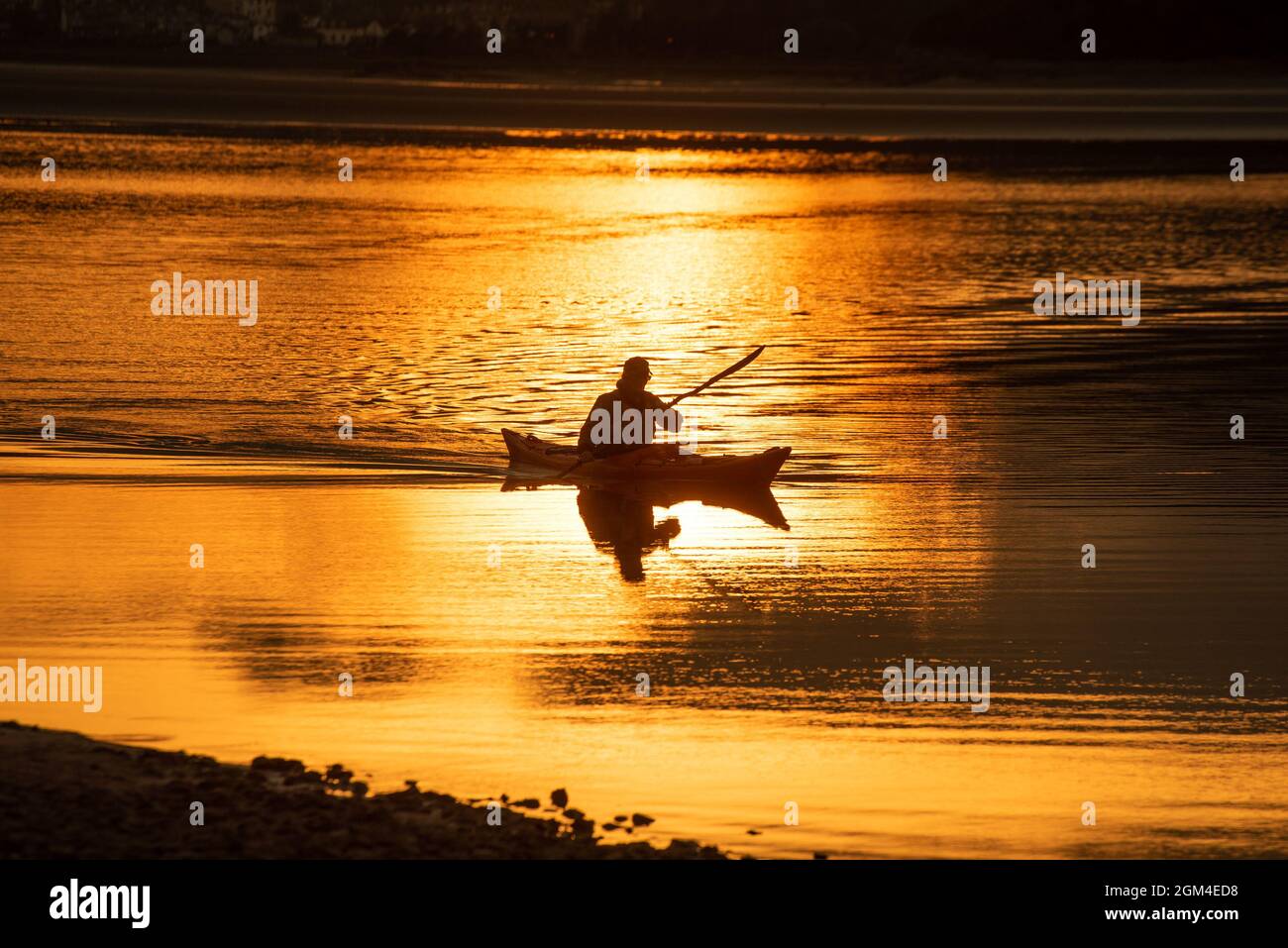 Grange-over-Sands, Cumbria, UK. 16th Sep, 2021. Annette Morris enjoying an evening kayaking as the sun sets behind Grange-over-Sands, Cumbria, UK Credit: John Eveson/Alamy Live News Stock Photo